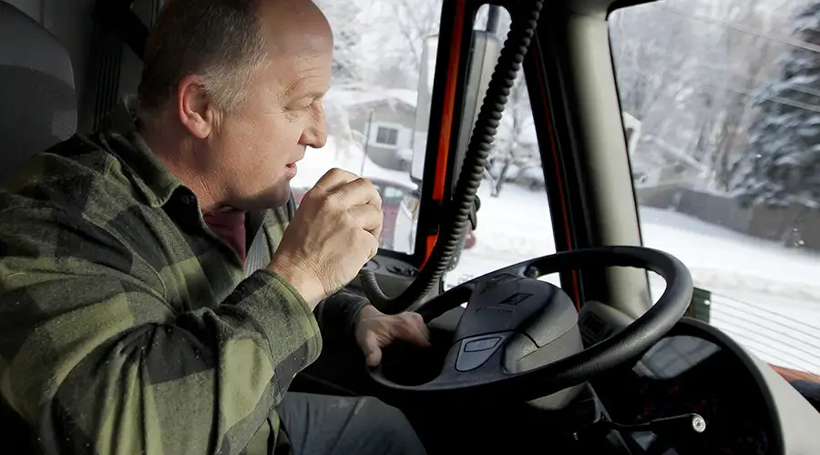 Snow Plow Driver Talking On Two-Way Radio